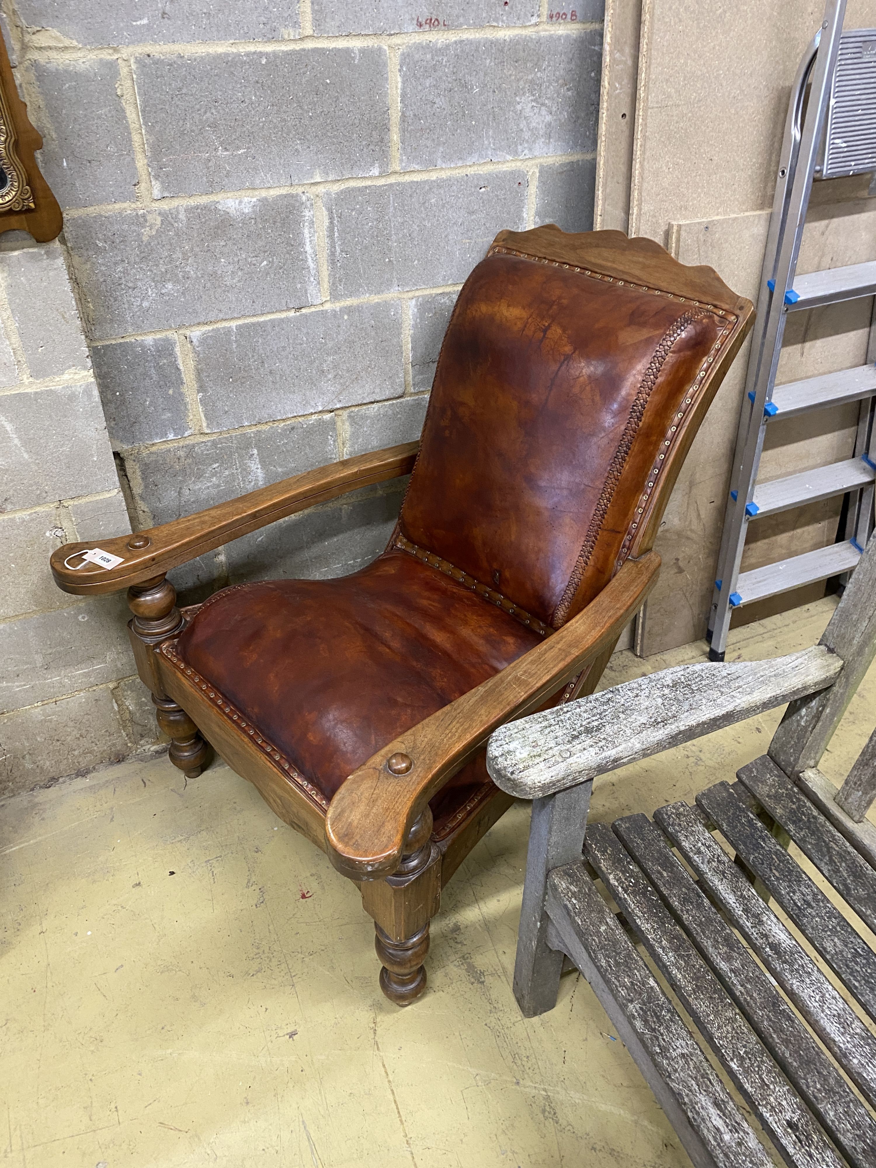 A leather upholstered hardwood plantation chair, width 91cm, depth 94cm, height 106cm